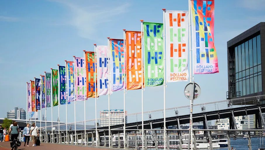 Flags along the river for Holland Festival