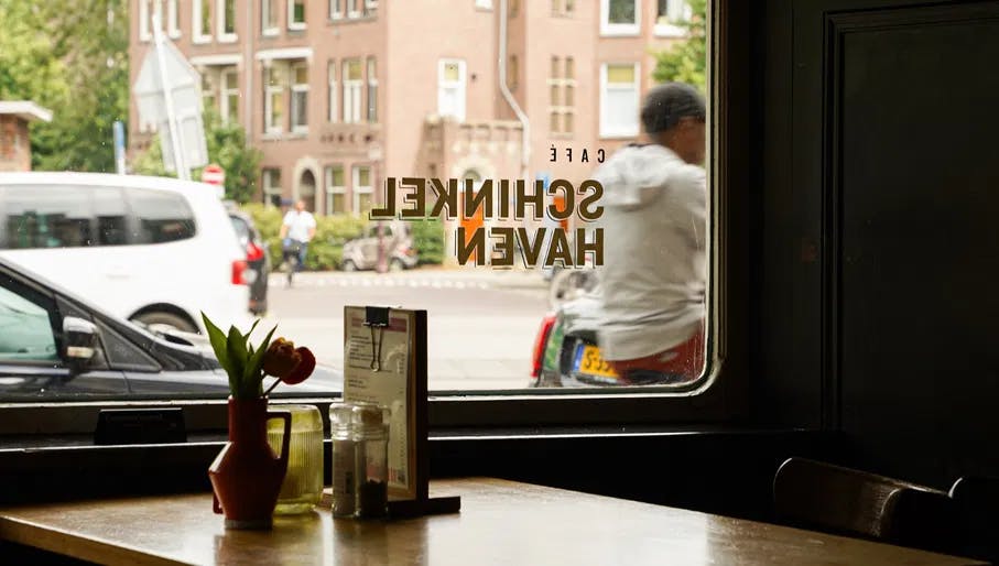 Café Schinkelhaven interior with view through the window