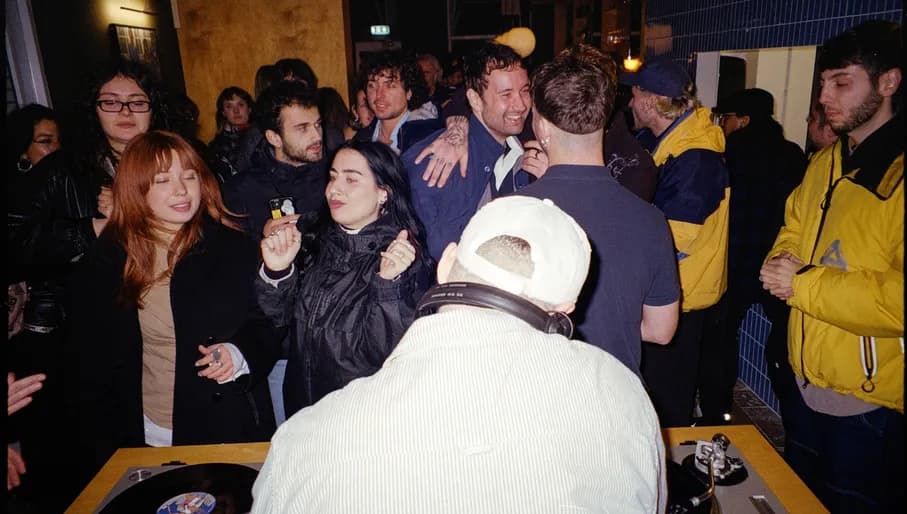 Loop51 audio bar people dancing around the DJ