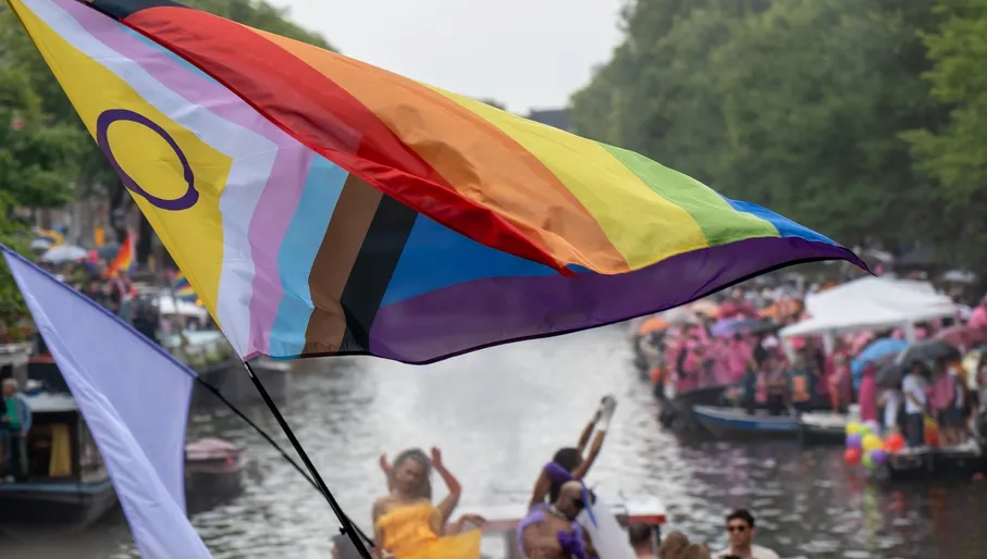 Big rainbow flag during the Canal Parade of Amsterdam Pride 2025.