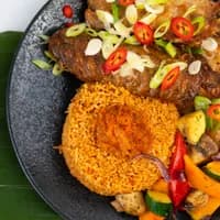 Rice and meat dish at Fresh Leaves Congolese African restaurant in Zuidoost