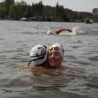 Couple of swimmers embracing during LoveSwim 2024