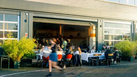 Bar Dancing Multipla people sitting on the terrace during the day