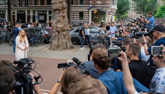 Princess Amalia of the Netherlands stands in front of press in Amsterdam