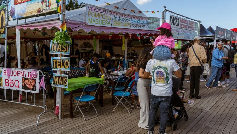 People walking next to the food stalls at the doodcourt at Kwaku Summer Festival.