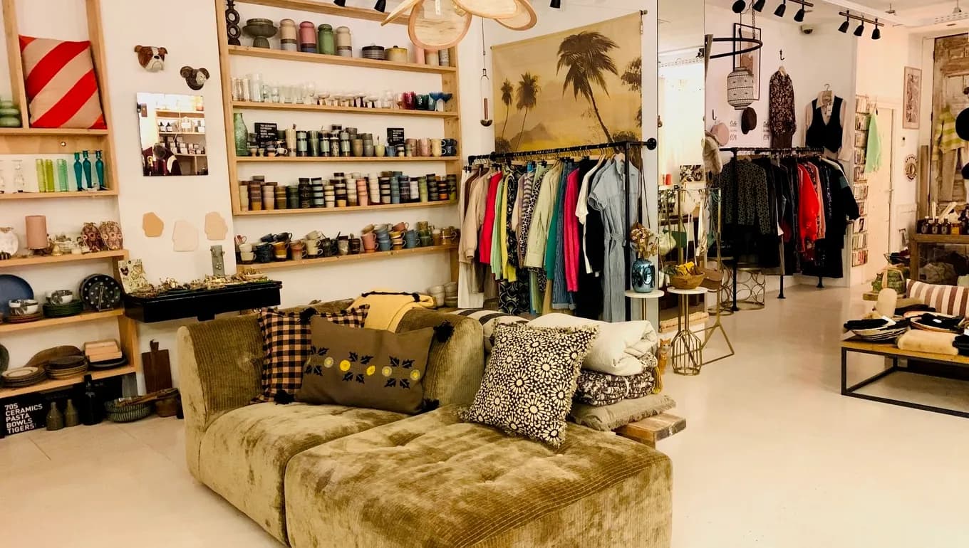 Store A Lovely Day interior, couch sofa with items in the background