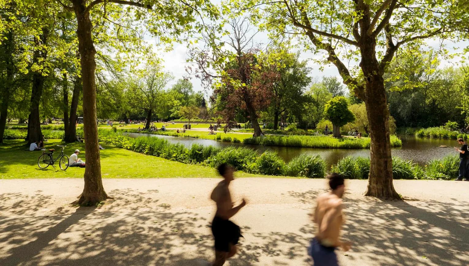 Joggers running through Vondelpark.