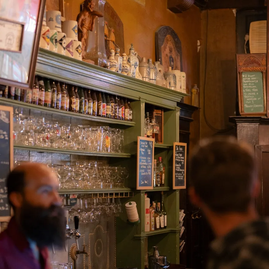 People in brown bar Bierproeflokaal In De Wildeman