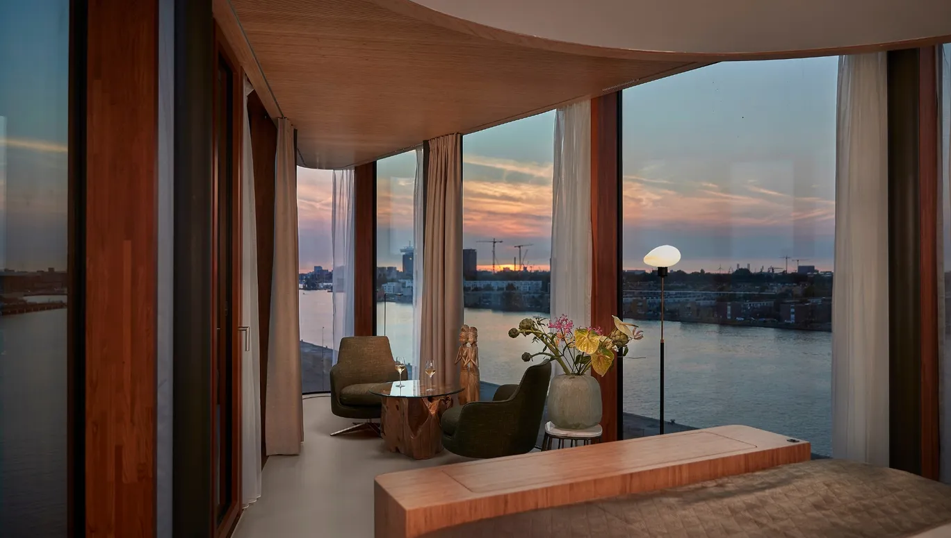 Hotel Jakarta Junior Suite interior and view on 't IJ