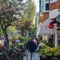 Busy street with ice cream parlour