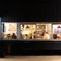 FC Hyena cinema restaurant exterior at night