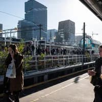 2AE4KGB Young office workers at the business hub Amsterdam South (Zuidas) in Amsterdam, Netherlands, close to Schiphol Airport.