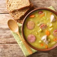 Classic Dutch pea soup erwtensoep, snert closeup in the plate on the table. horizontal top view from above
1873721881
Typically Dutch foods