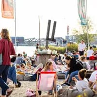 People chilling on the city beach of Pllek