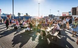 Over het IJ Festival 2019 people sitting in the food area