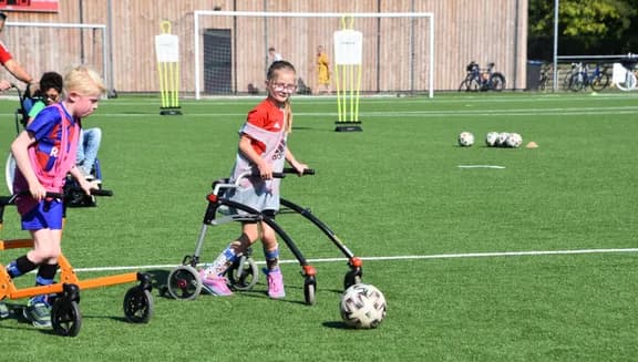 Only Friends disabled kids playing football outside