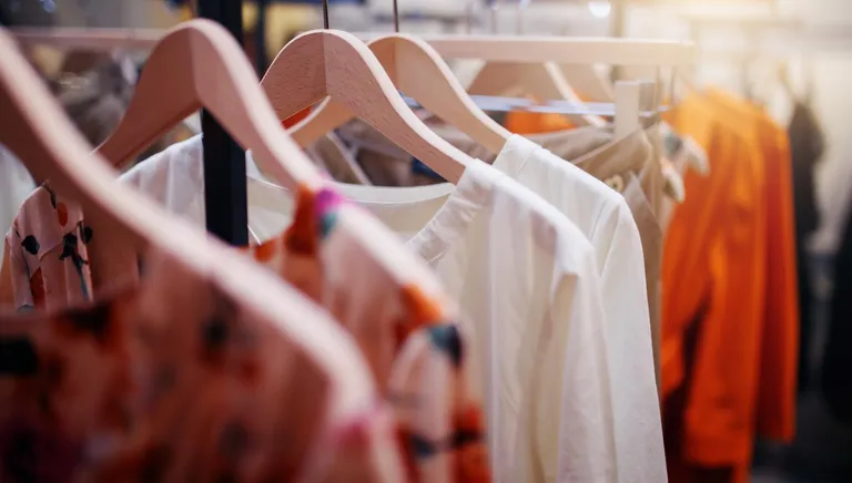 Clothing on hanger at the modern shop boutique
