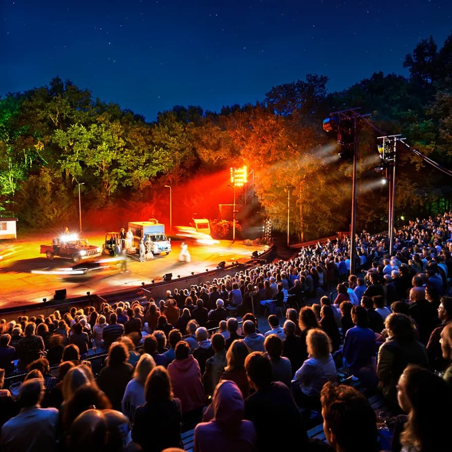 Amsterdamse Bos Theater audience watching a performance at night