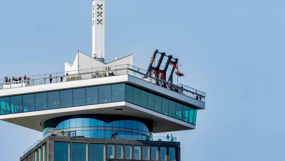 A'dam building in Amsterdam with the lookout tower, revolving restaurant and swim. Dutch attraction for tourism and views in gorgeous sunshine with blue sky
