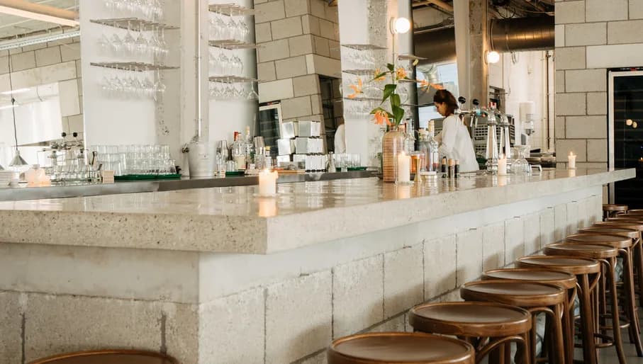 Bartender behind bar at Cafe Restaurant Metro