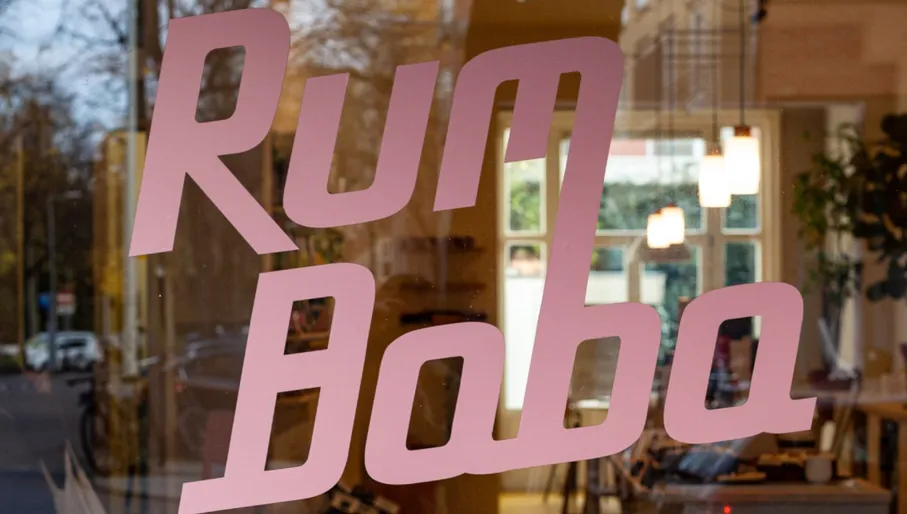 Rum Baba café exterior logo