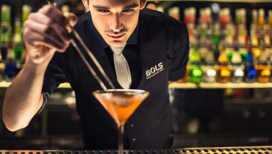 House of Bols bartender preparing a cocktail