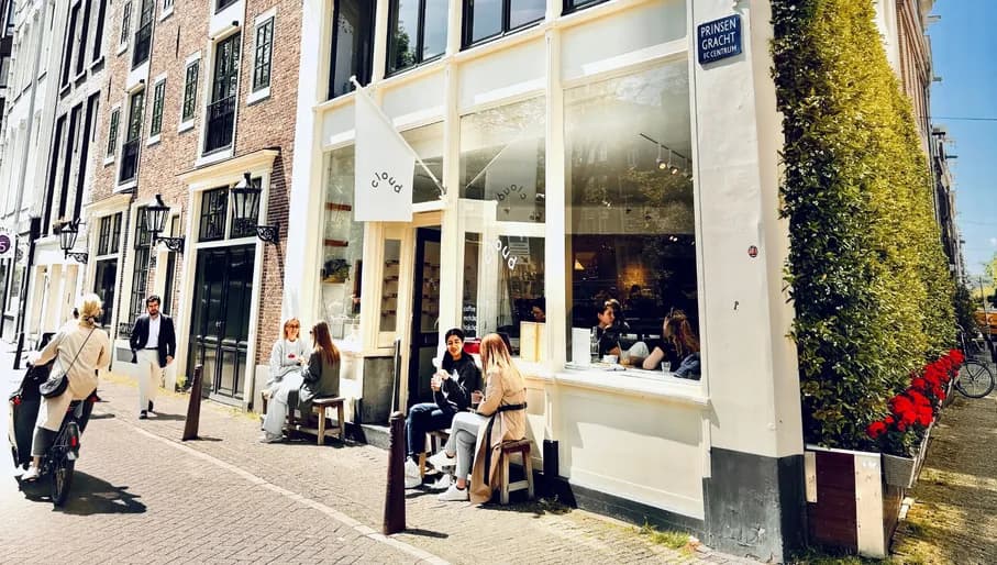 Cloud Gallery people sitting in front outside in the sun