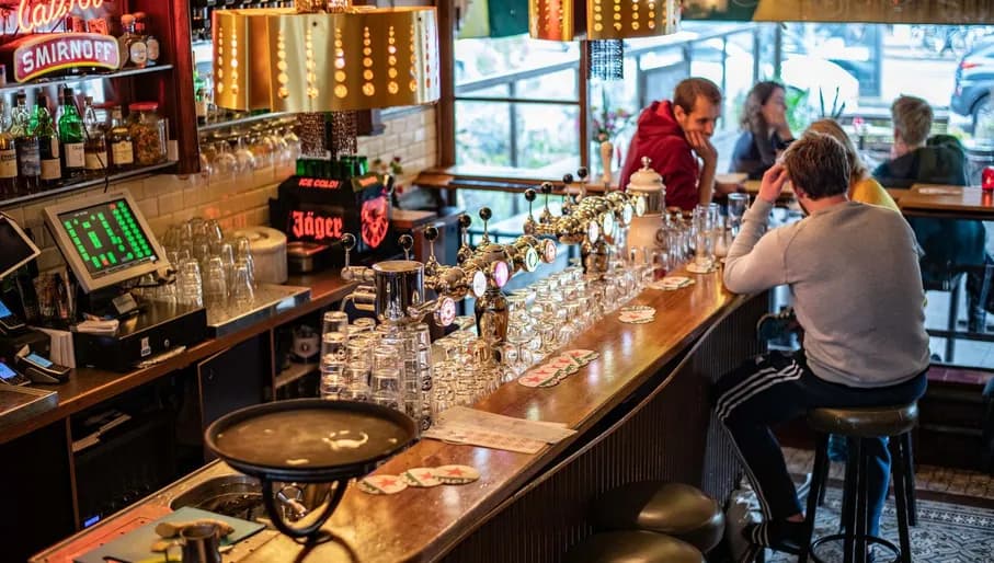 People having drinks at Café Kuijper interior
