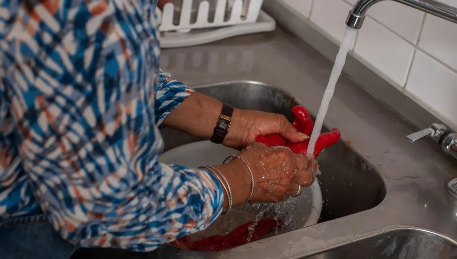 Floor the chef cooking in the kitchen of Floor's Catering roti shop Amsterdam