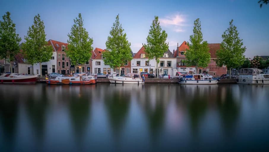 Treeline canal with docked boats - internal use royalty free, external use editorial only