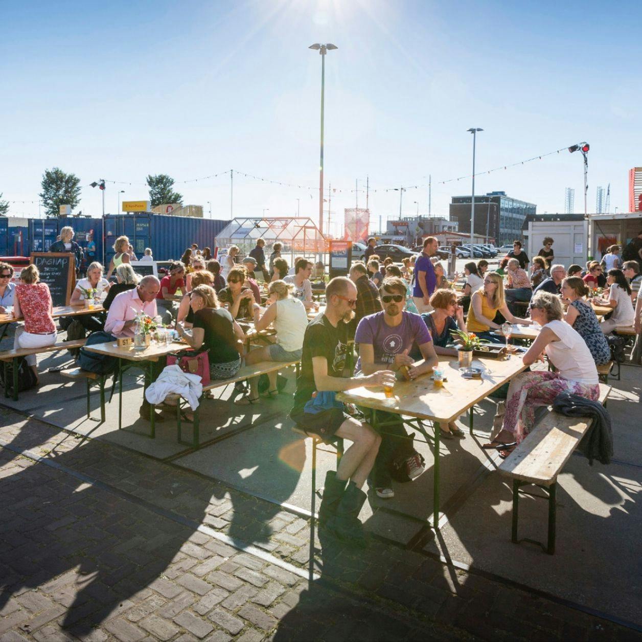 Over het IJ Festival 2019 people sitting in the food area