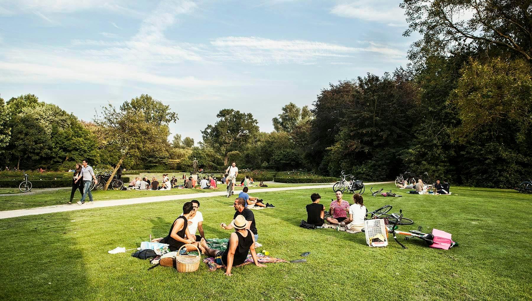 People sitting on the grass in Vondelpark in Summer