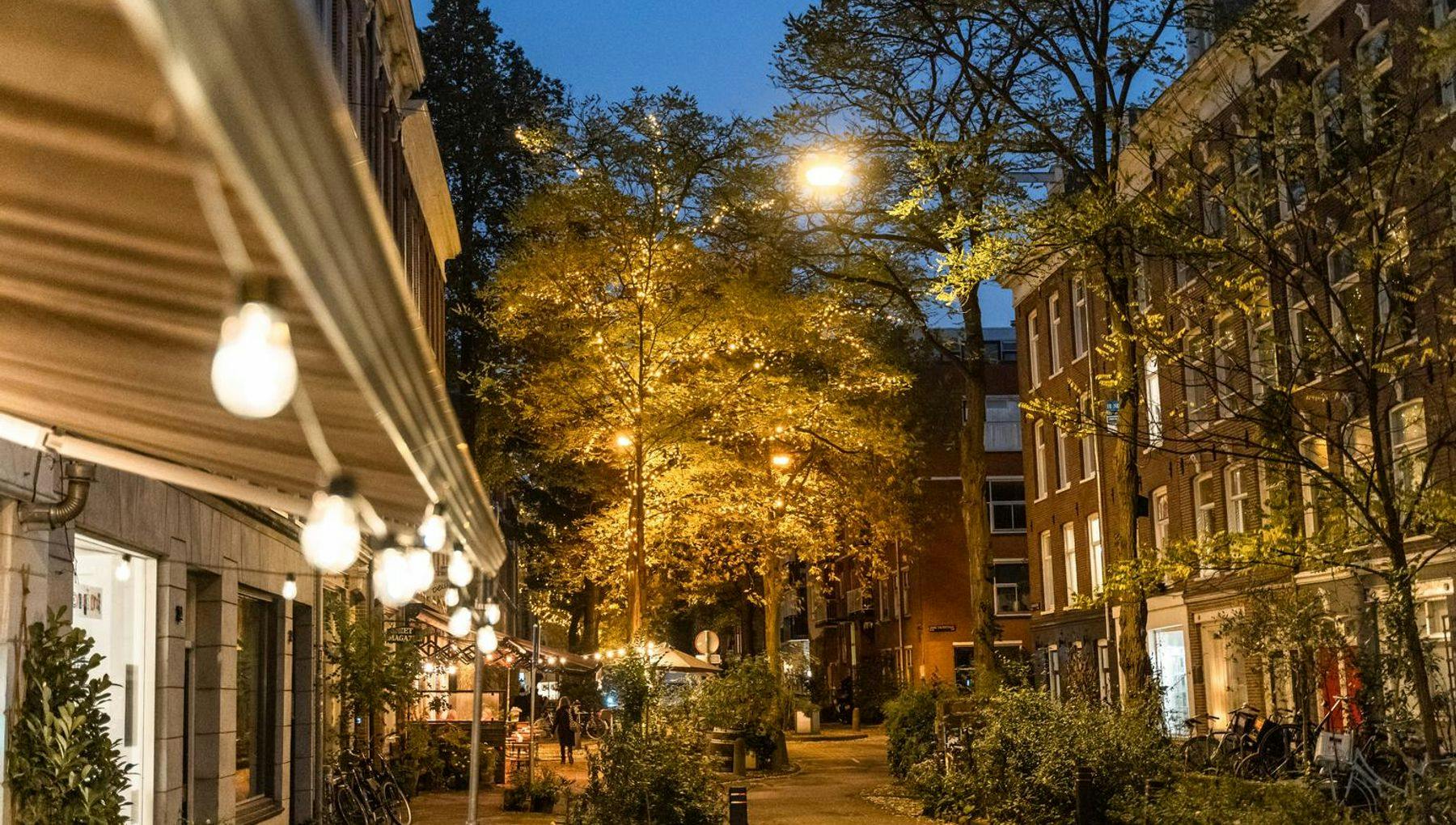 The Frans Halsstraat in De Pijp at night (with cafes and houses)
