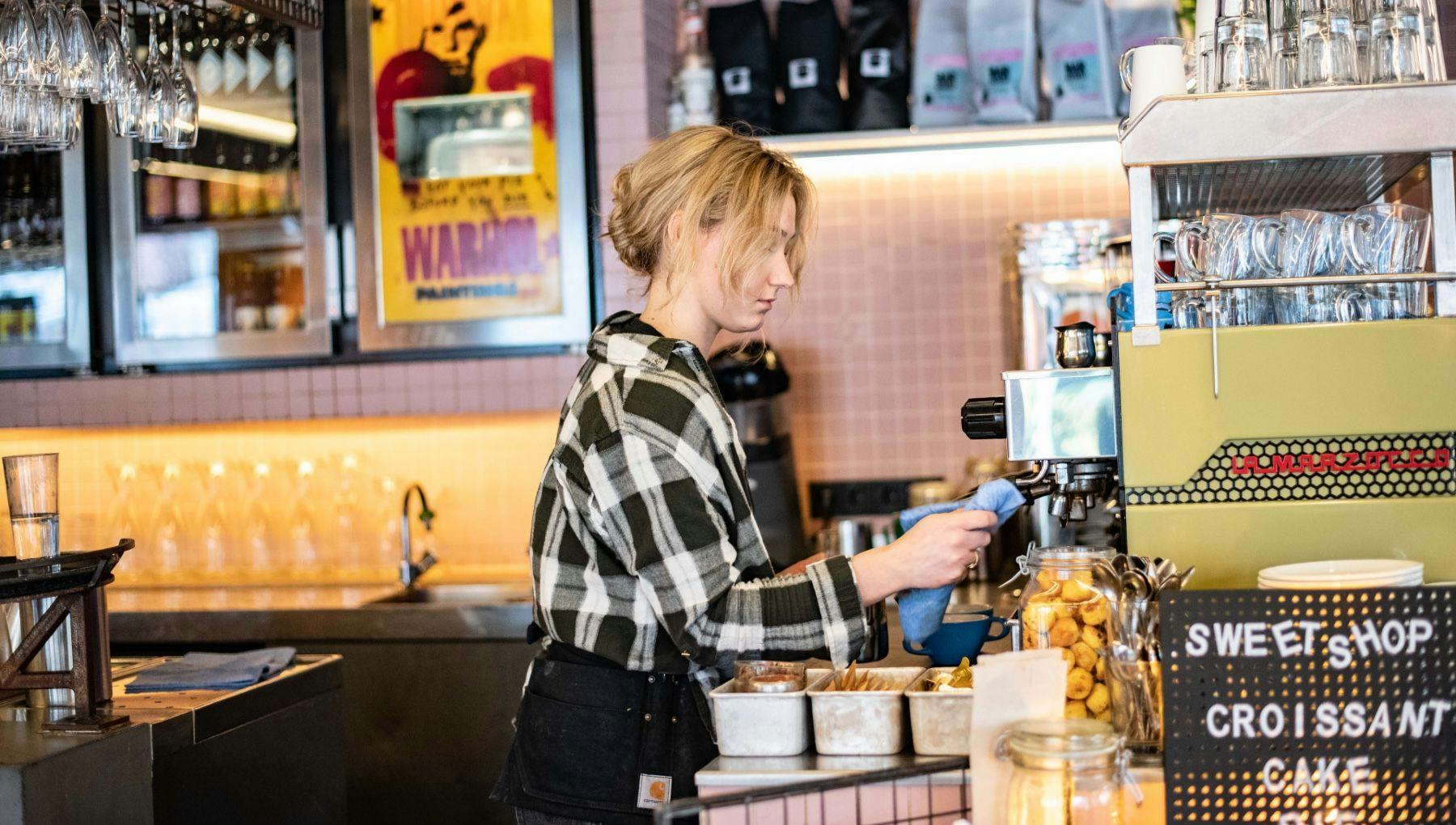 Bar Basquiat restaurant woman making coffee