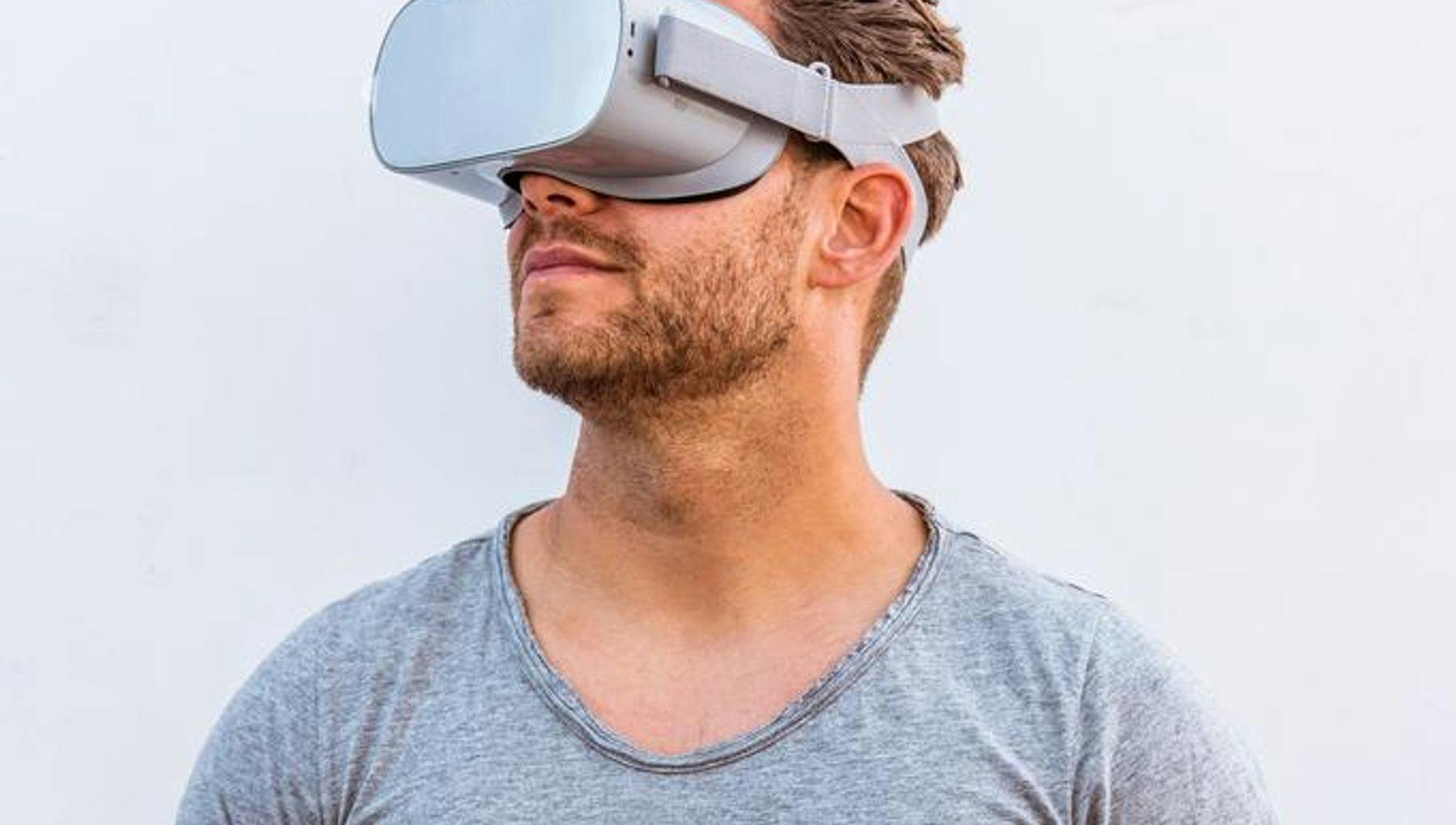 A man wearing virtual reality glasses