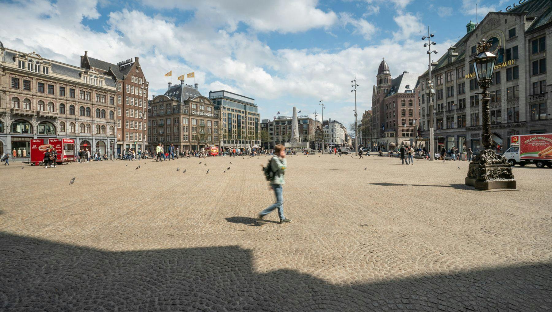Overview of Dam Square with a view of the National Monument