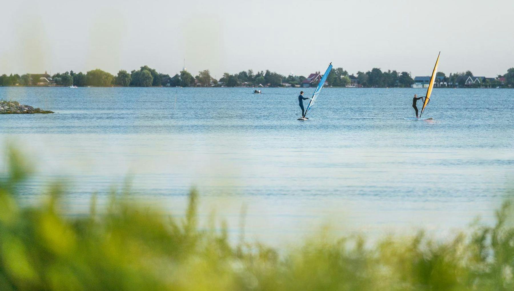 Two windsurfers on the Westeinderplassen near Aalsmeer.