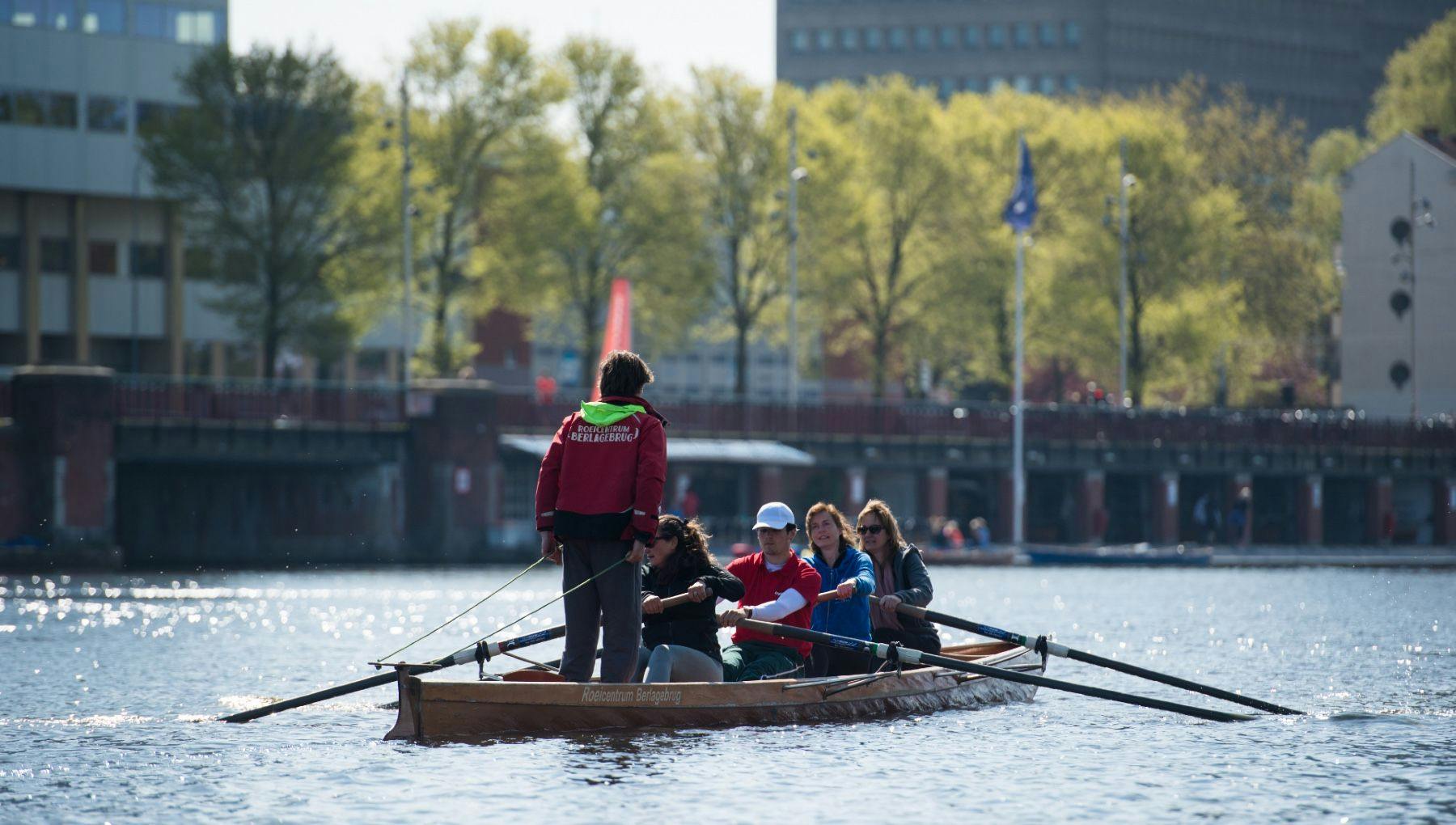 Roeivereniging Berlagebrug people rowing on the Amstel river