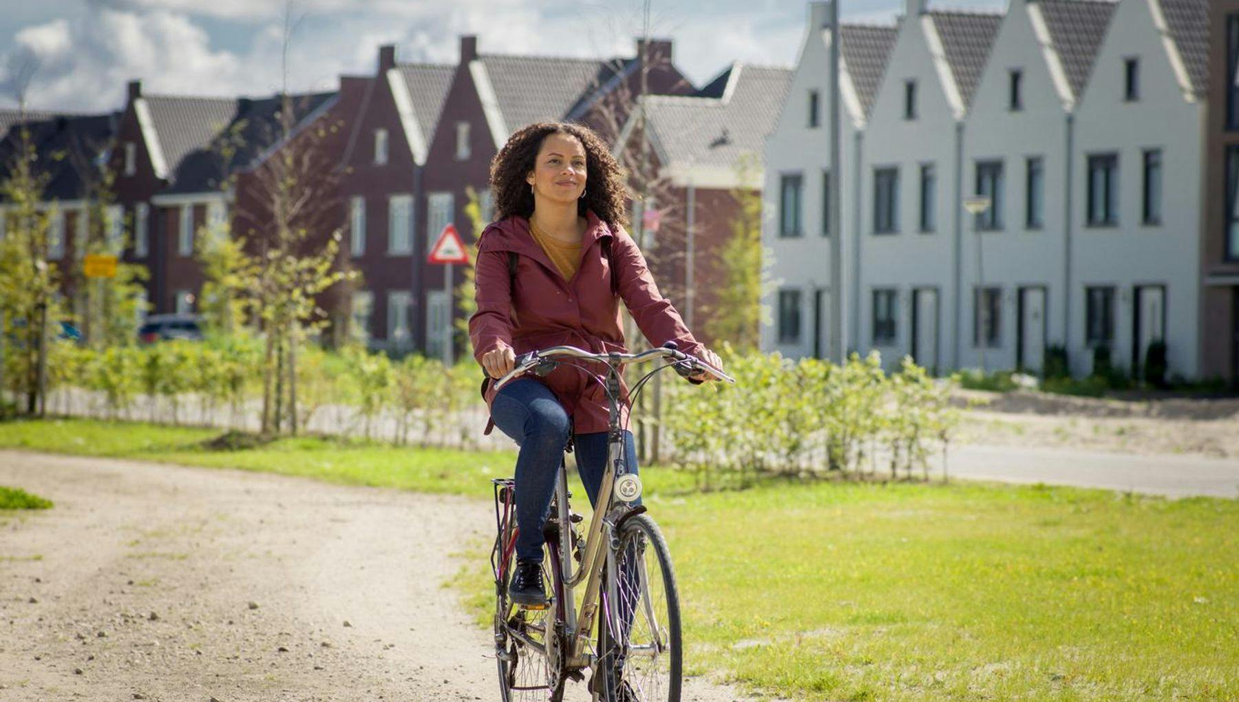 Woman cycling in Almere.