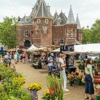 Nieuwmarkt market flower stalls and De Waag