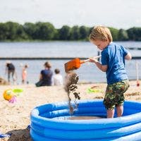 Beach Sloterplas,   child playing on the beach