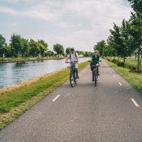 Man and woman cycling in the countryside