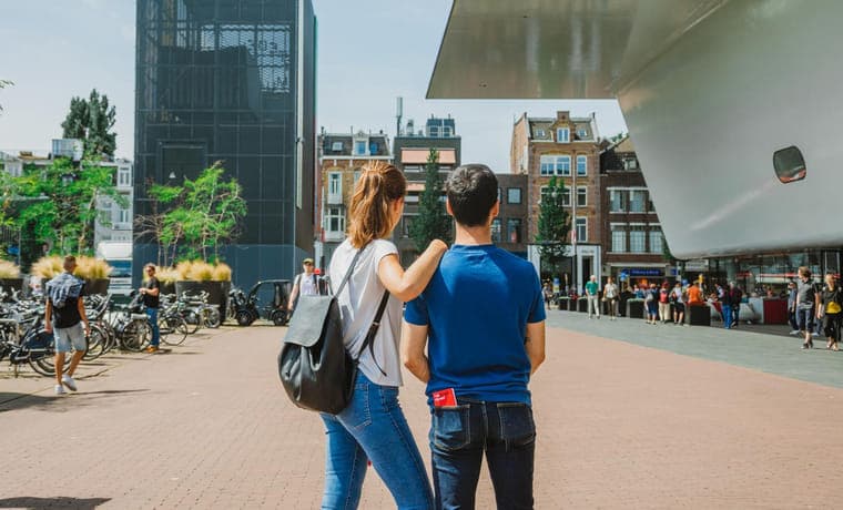 A couple at the Museumplein Stedelijk Museum