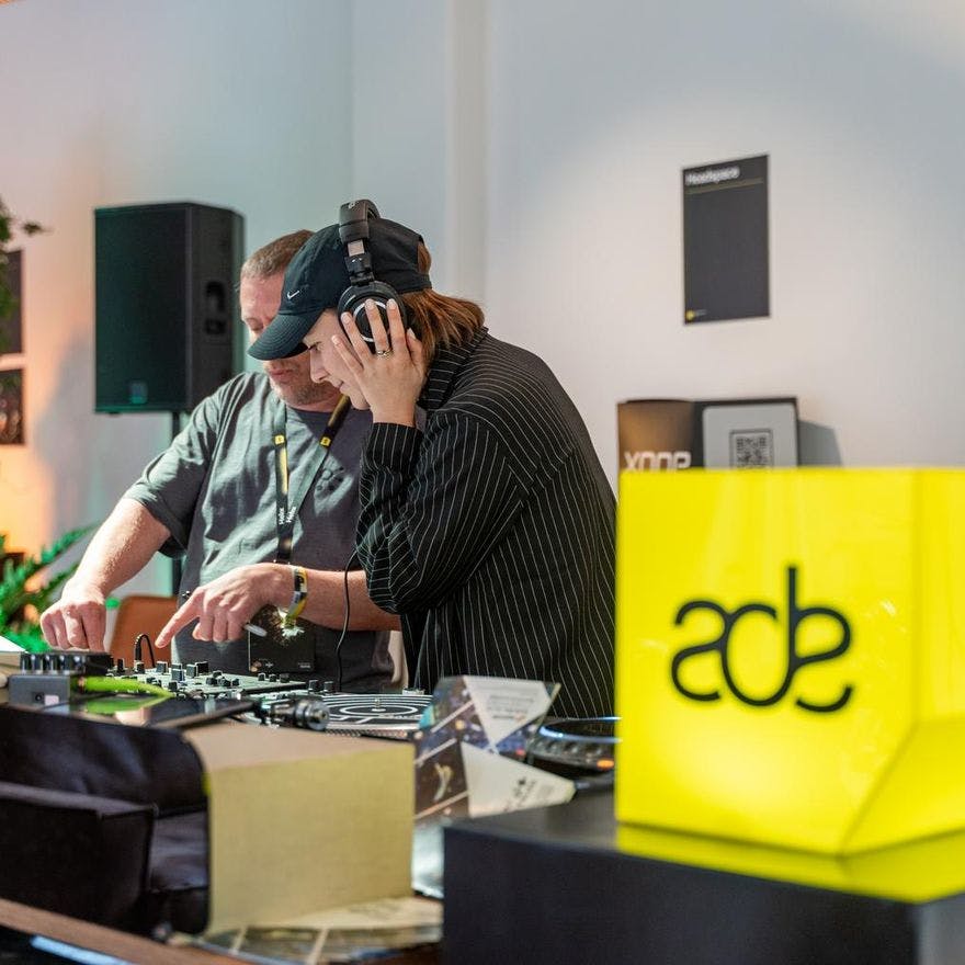Man and woman DJ'ing in De Brakke Grond during Amsterdam Dance Event (ADE) 2022.