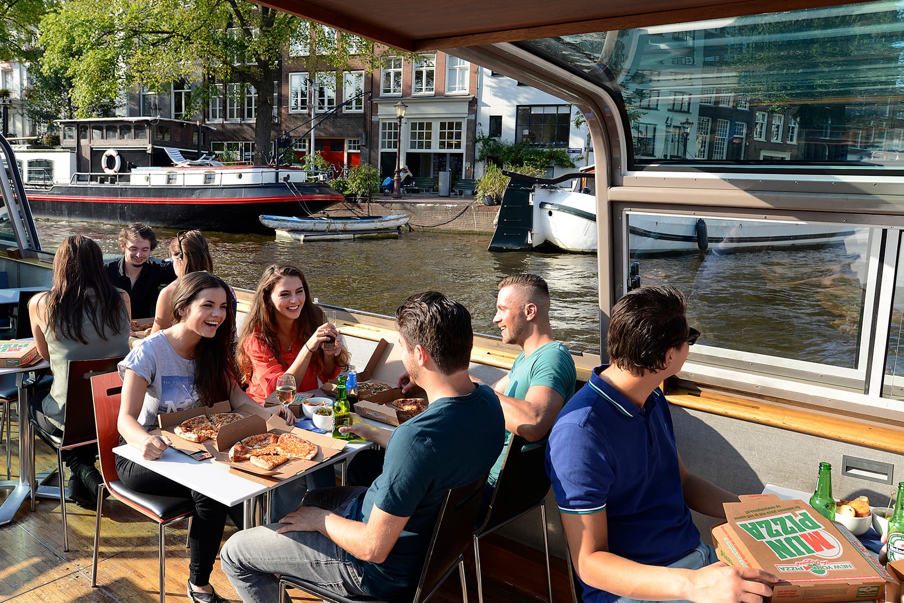 Pizza Cruise On a sunny day overview with pizza and young people