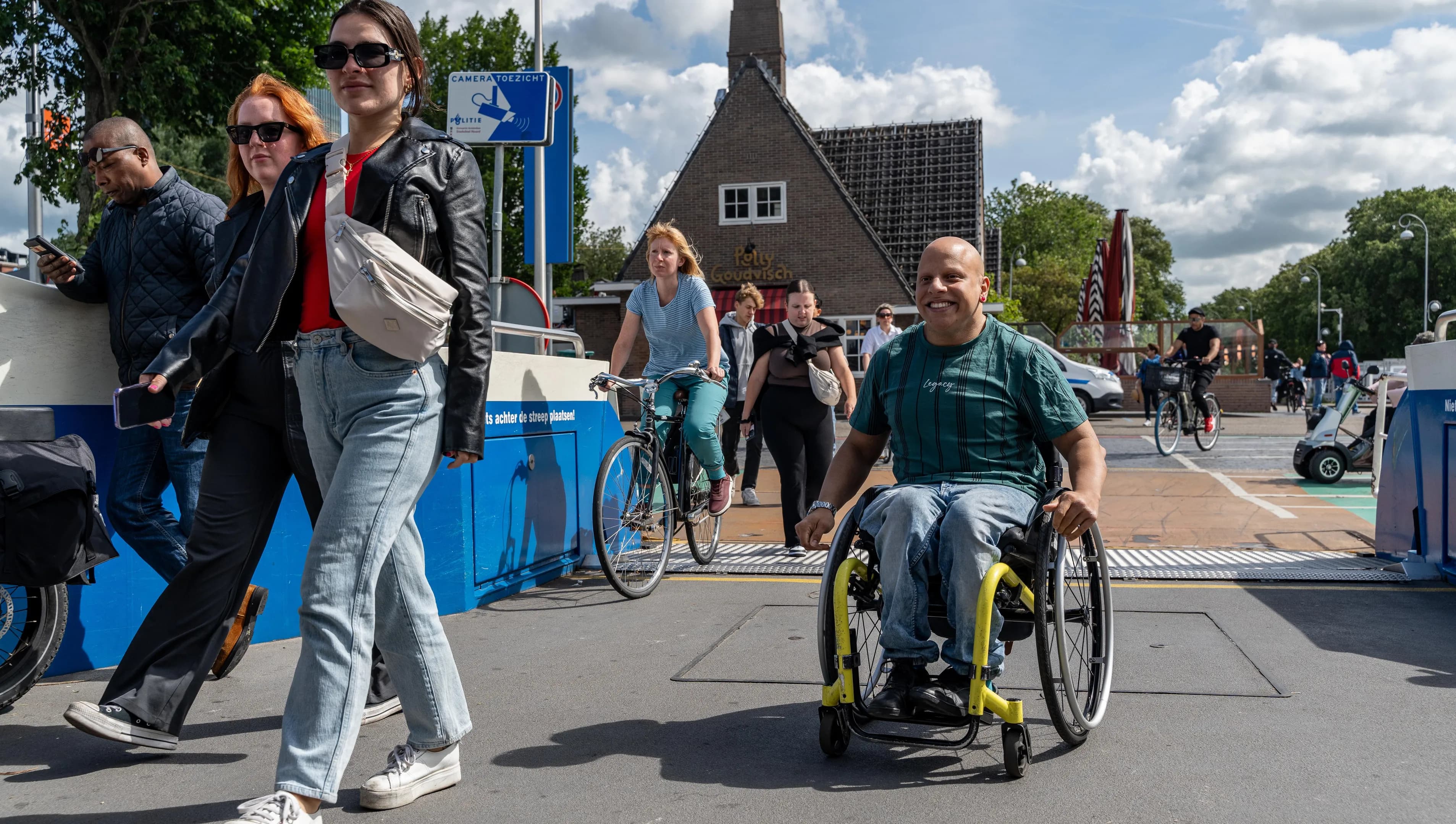 A person in a wheelchair taking the ferry.