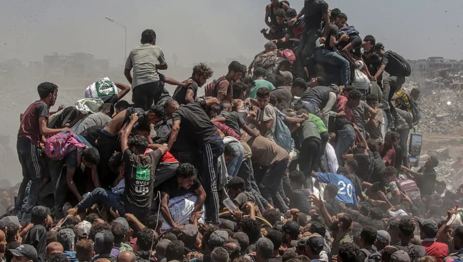 Title: Aid Emergency in Gaza
Credit: © Saber Nuraldin, EPA Images
Caption: Palestinians climb onto an aid truck as it enters the Gaza Strip via the Zikim Crossing in an attempt to get flour, during what the Israeli military called a “tactical suspension” in operations to allow humanitarian aid through. 27 July 2025.
Story: In 2025, famine took hold amid what an independent UN Human Rights Commission inquiry has concluded is a genocide in Gaza. Israel disputes this.
Israeli authorities imposed a complete aid blockade in March, a tactic described by humanitarian organizations as the weaponization of starvation. When international pressure led to a partial reopening of crossings in May, most deliveries went through the Gaza Humanitarian Foundation (GHF), established by the US and Israel to bypass the UN-led aid system. Its operation, which put military personnel in charge, was widely condemned by global human rights and legal organizations as unethical and in violation of international law. The UN reports that between late May and early October, at least 2,435 Palestinians were killed seeking food at or near GHF collection points.
The GHF shut down when a fragile ceasefire went into effect in October. Despite some aid entering Gaza, more than 75% of the population still faced hunger and malnutrition in December. The photographer was born in Gaza and has documented life there since 1997.
