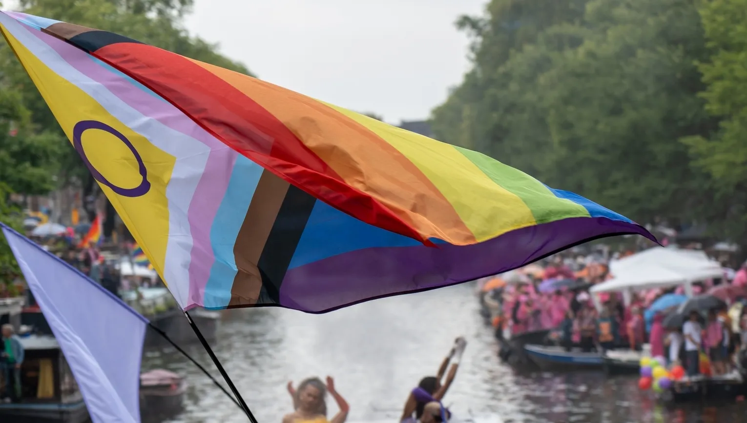 Big rainbow flag during the Canal Parade of Amsterdam Pride 2025.