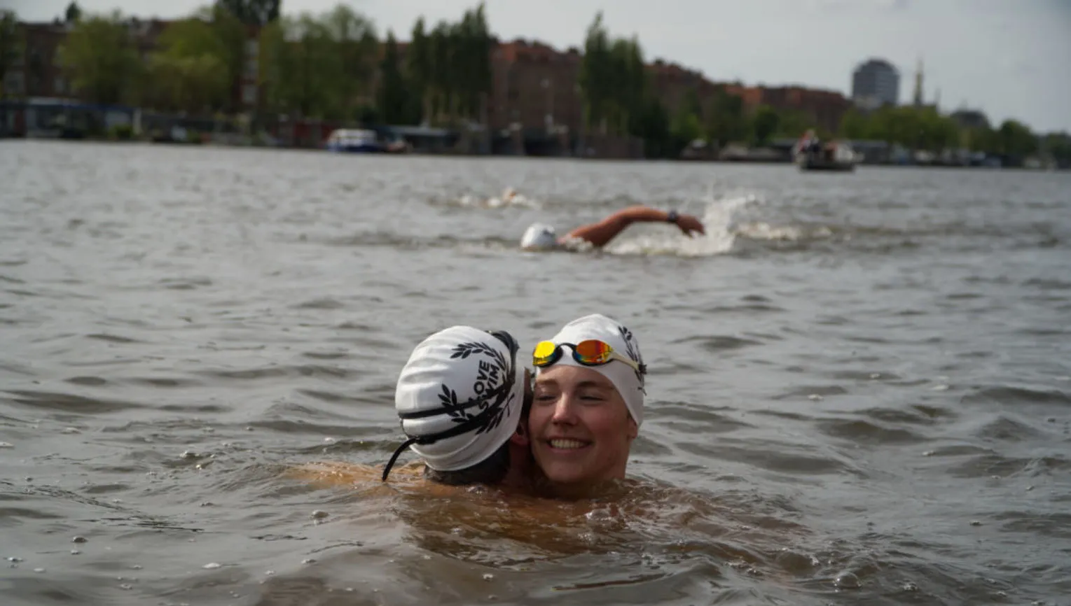 Couple of swimmers embracing during LoveSwim 2024