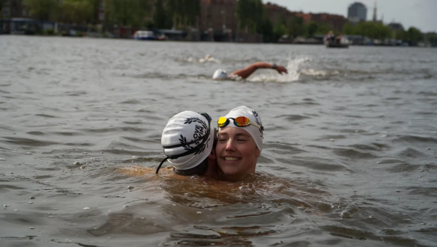 Couple of swimmers embracing during LoveSwim 2024